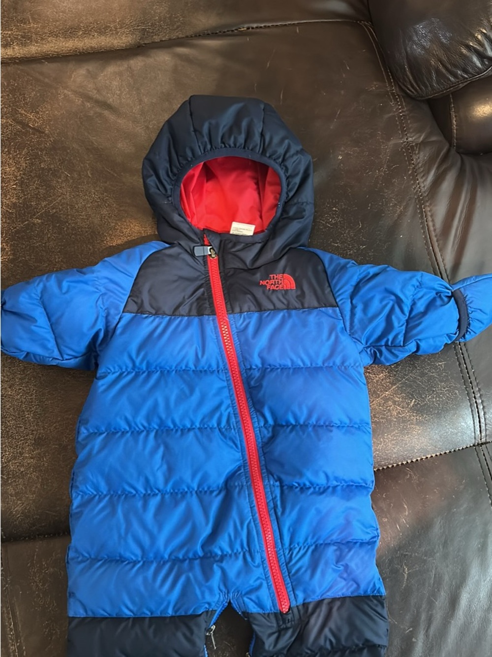 The North Face Kids Blue and Black Puffer Jacket with Red Logo & Trim